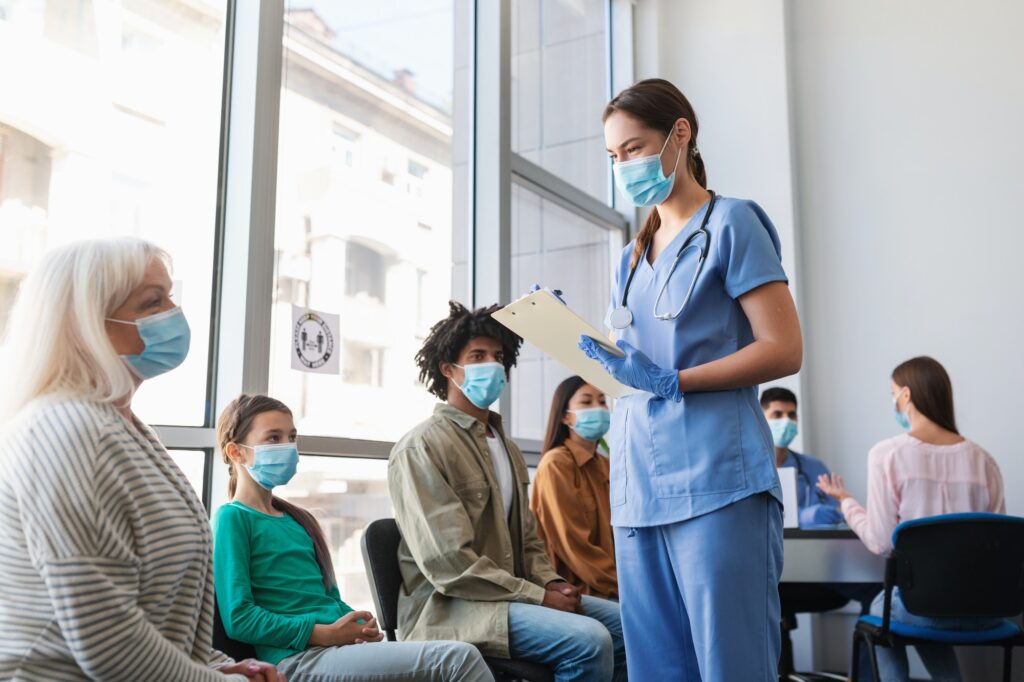 Patients Waiting For Covid-19 Vaccination Sitting In Queue In Hospital